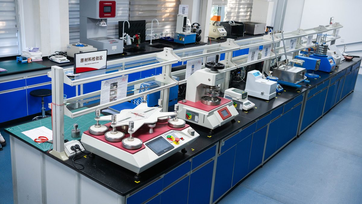 QC raw material testing laboratory — SAP, nonwoven, and PE film inspection